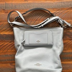 Large Coach purse. Light Blue, matching wallet and an additional shoulder strap.